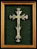 A FRAMED MOTHEROFPEARL CRUCIFIX