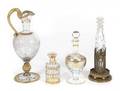 FOUR PARCEL GILT DECANTERS