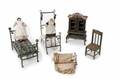 GROUP OF ANTIQUE DOLLHOUSE BEDS WITH TWO ANTIQUE DOLLS