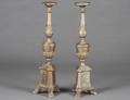 PAIR OF RENAISSANCE STYLE CARVED AND SILVERED TORCHERES