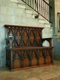 A VICTORIAN GOTHIC REVIVAL OAK SETTLE