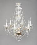 EVANDER HOLYFIELD CRYSTAL AND BRASS SIX LIGHT CHANDELIER