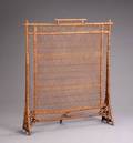 A HEYWOODWAKEFIELD STYLE WICKER FIRE SCREEN