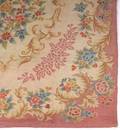A VINTAGE FLORAL HOOKED AREA RUG