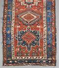 A PERSIAN AREA RUG
