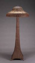 A GUSTAV STICKLEY WICKER FLOOR LAMP