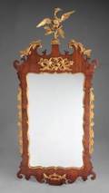 A CHIPPENDALE PARCEL GILT MAHOGANY WALL MIRROR