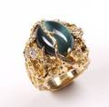 ELVIS RING WITH CATS EYE GREEN STONE