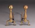 A PAIR OF BRASS BALL TOP ANDIRONS AND FIREPLACE TOOLS