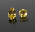 DOM DELUISE TWO UNMOUNTED HELIODOR GEMSTONES