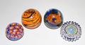 117 GROUP OF FOUR SMALL GLASS PAPERWEIGHTS