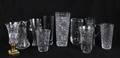 GROUP OF TEN TALL ASSORTED ETCHED AND CUT GLASS TABLE ITEMS