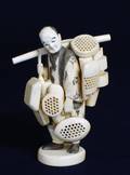 203 CARVED IVORY FIGURE OF A PEDDLER