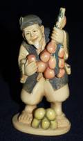 202 CARVED IVORY FIGURE OF A FRUIT SELLER