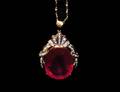 240 FOURTEEN KARAT GOLD RUBY AND DIAMOND PENDANT AND