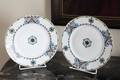 SET OF KORNILOW BROTHERS DINNER PLATES