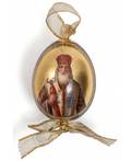 A RUSSIAN PORCELAIN EASTER EGG WITH IMAGE OF SAINT VASILI