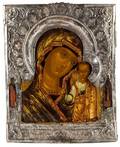 A RUSSIAN ICON OF THE KAZANSKAYA MOTHER OF GOD IN A SILVER BASMA OKLAD 17TH CENTURY