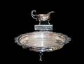 230 SILVER PLATED SAUCE BOAT AND CIRCULAR TRIFOOTED B