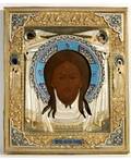 A RUSSIAN ICON OF JESUS CHRIST IN A GILTSILVER AND CLOISONN ENAMEL OKLAD 18991908