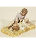 GARDNER PORCELAIN FIGURE OF CHILDREN LAYING ON A HAY STACK