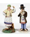 A PAIR OF RUSSIAN PORCELAIN FIGURES OF MERRY PEASANTS POPOV PORCELAIN MANUFACTORY MID 19TH C