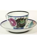 A RUSSIAN IMPERIAL PORCELAIN CUP AND SAUCER WITH EARLY SOVIET DECORATION MANUFACTURED FOR THE RUSSIAN IMPERIAL PORCELAIN FACTORY 1895 ILLUSTATED BY ALEXANDRA SCHEKATIKHINAPOTOTSKAYA STATE PORCELAIN FACTORY 1919