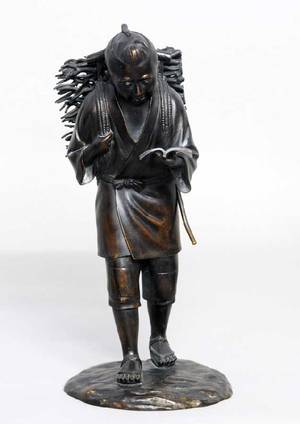 208 PATINATED BRONZE FIGURE OF A WOOD CUTTER