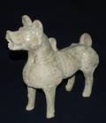 265 BEIGEBROWN GLAZED RED POTTERY FIGURE OF A DOG