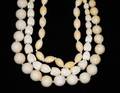 574 GROUP OF THREE IVORY BEAD NECKLACES