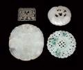 570 GROUP OF FOUR CARVED JADE PENDANTS