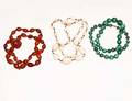 279 GROUP OF THREE CARVED BEAD NECKLACES
