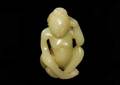 315 CELADON JADE FIGURE OF A SEATED NUDE