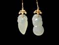32 PAIR OF FOURTEEN KARAT YELLOW GOLD AND JADE EARRING