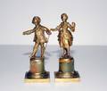 2 PAIR OF GILT BRONZE AND ONYX FIGURES