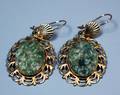 12 PAIR OF CARVED SERPENTINE AND GILT METAL EARRINGS