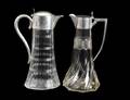 69 TWO STERLING SILVER MOUNTED GLASS JUGS