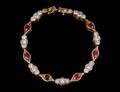 108 FOURTEEN KARAT GOLD RUBY AND DIAMOND BRACELET