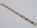 84 EIGHTEEN KARAT YELLOW GOLD DIAMOND AND RUBY BRACEL