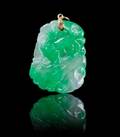 A Carved Jadeite Pendant