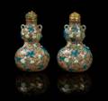 A Pair of Polychrome and Gilt Enameled Porcelain Snuff Bottles