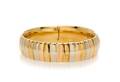 An 18 Karat Tri Color Gold Bangle Bracelet