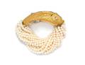A Two Tone Gold Diamond and Cultured Pearl Torsade Bracelet