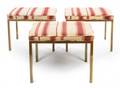 A Set of Three Brass Foot Stools