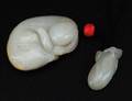 190 TWO CARVED WHITE JADE PENDANTS