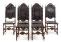 A Set of Six Spanish Baroque Style Walnut Dining Chairs