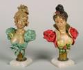 A Pair of Painted Spelter Busts of Women