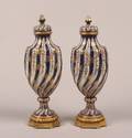 A Pair of Continental Porcelain Covered Vases
