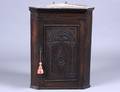 397 PROVINCIAL STYLE CARVED OAK HANGING CORNER CUPBOAR