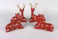 A Group of Four Painted and Gilded Figures of Deer